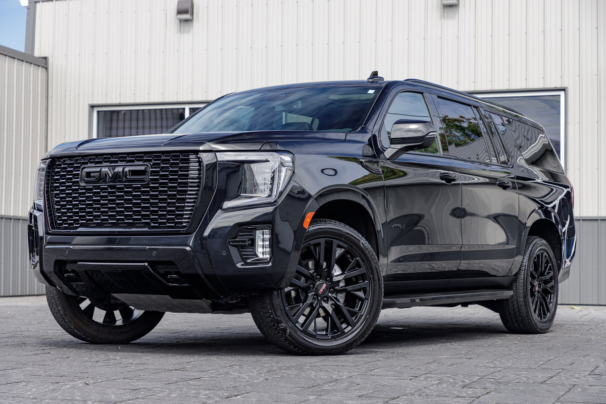 2023 GMC Yukon XL AT4 with GMC Factory suspension, 22x9 GMC Stock wheels, and Bridgestone Alenza tires.