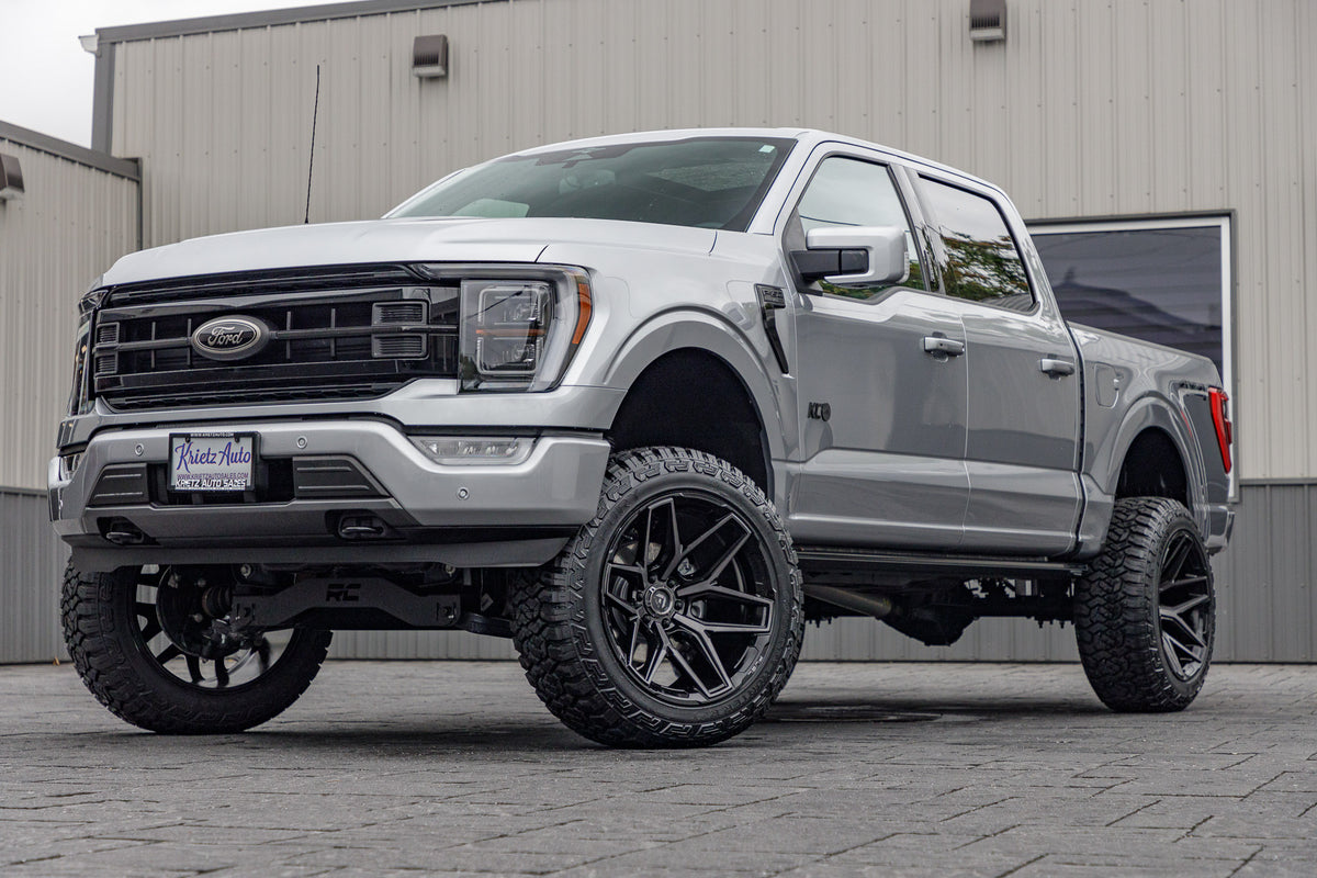 2023 Ford F-150 XLT with a 6" Rough Country lift kit, 22x12 Fuel Flux wheels, and 35" Fury Country Hunter R/T tires.