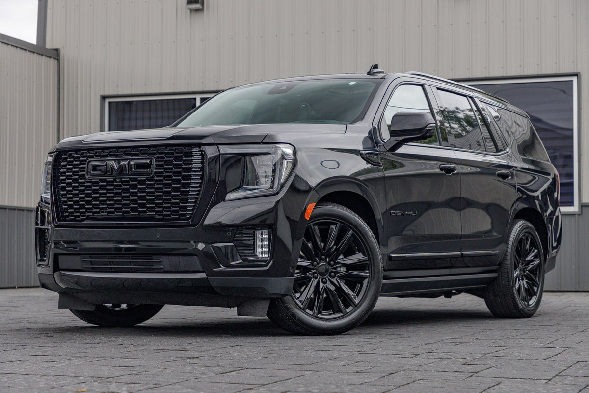 2023 GMC Yukon Denali Ultimate with GMC Factory suspension, 22x9 GMC Stock wheels, and Bridgestone Alenza tires.
