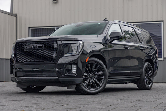 2023 GMC Yukon Denali Ultimate with GMC Factory suspension, 22x9 GMC Stock wheels, and Bridgestone Alenza tires.