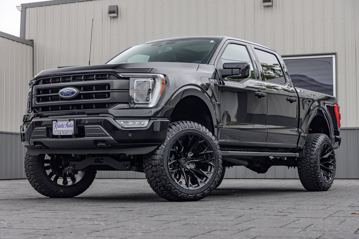 2023 Ford F-150 Lariat with a 6" Rough Country lift kit, 22x12 Fuel Flame wheels, and 35" Fury Country Hunter R/T tires.
