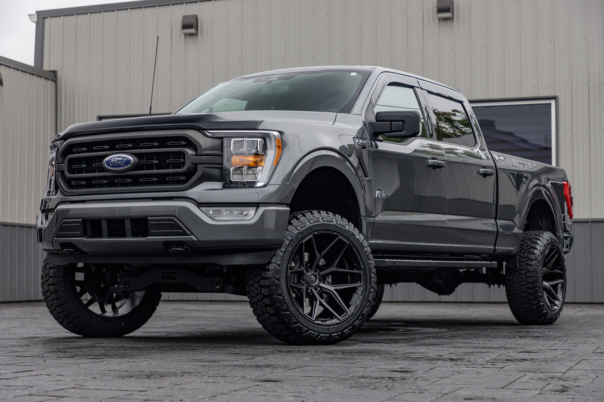 2023 Ford F-150 XLT with a 6" Rough Country lift kit, 22x12 Fuel Flux wheels, and 35" Fury Country Hunter R/T tires.