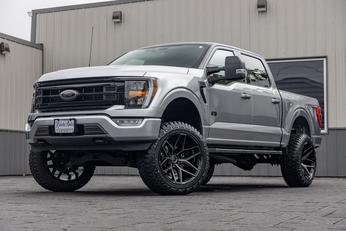 2022 Ford F-150 XLT with a 6" Rough Country lift kit, 22x12 Fuel Flux wheels, and 35" Fury Country Hunter R/T tires.