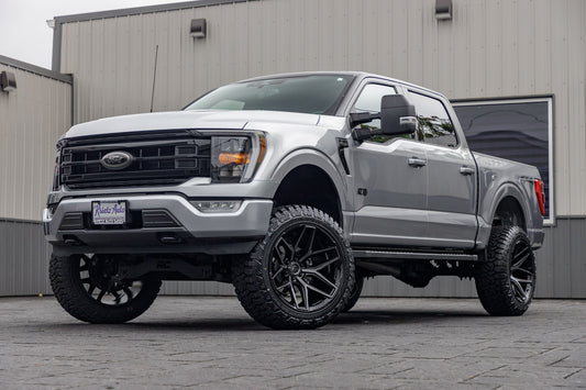 2022 Ford F-150 XLT with a 6" Rough Country lift kit, 22x12 Fuel Flux wheels, and 35" Fury Country Hunter R/T tires.