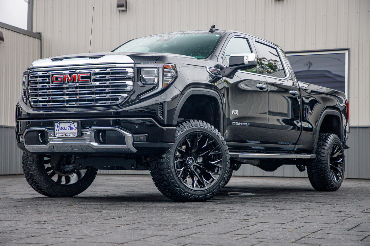 2023 GMC Sierra 1500 Denali with a 6" Rough Country suspension kit, 22x12 Fuel Flame wheels, and 35" Fury Country Hunter R/T tires.