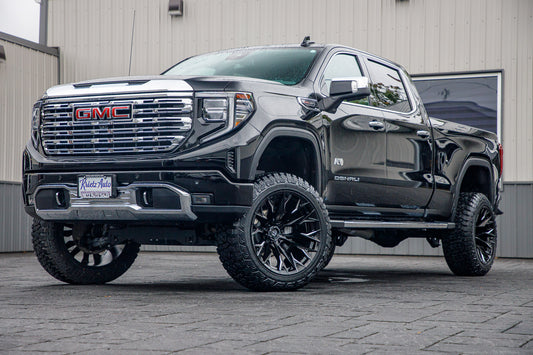 2023 GMC Sierra 1500 Denali with a 6" Rough Country suspension kit, 22x12 Fuel Flame wheels, and 35" Fury Country Hunter R/T tires.