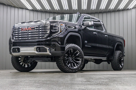2023 GMC Sierra 1500 Denali with a 6" Rough Country suspension kit, 22x12 Fuel Rebar wheels, and 35" Fury Country Hunter R/T tires.