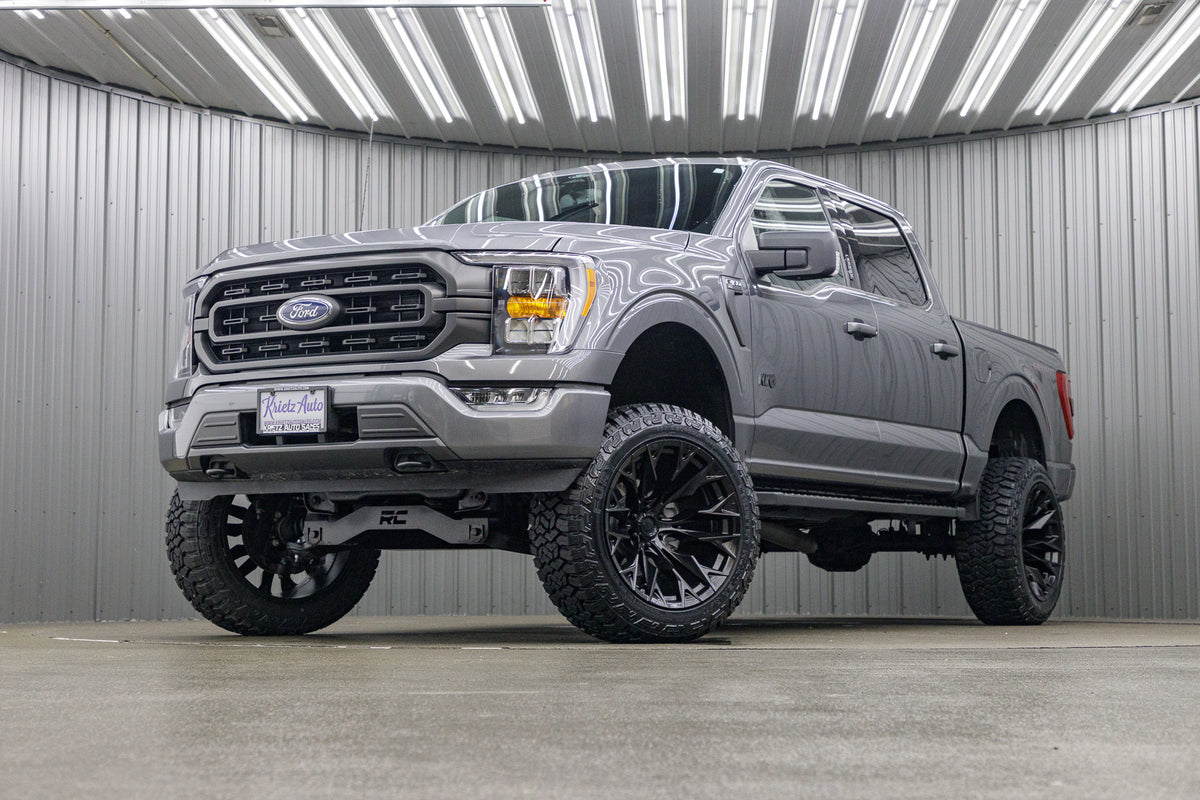 2022 Ford F-150 XLT with a 6" Rough Country Lift Kit, 22x12 Fuel Flame wheels, and 35" Fury Country Hunter R/T tires.