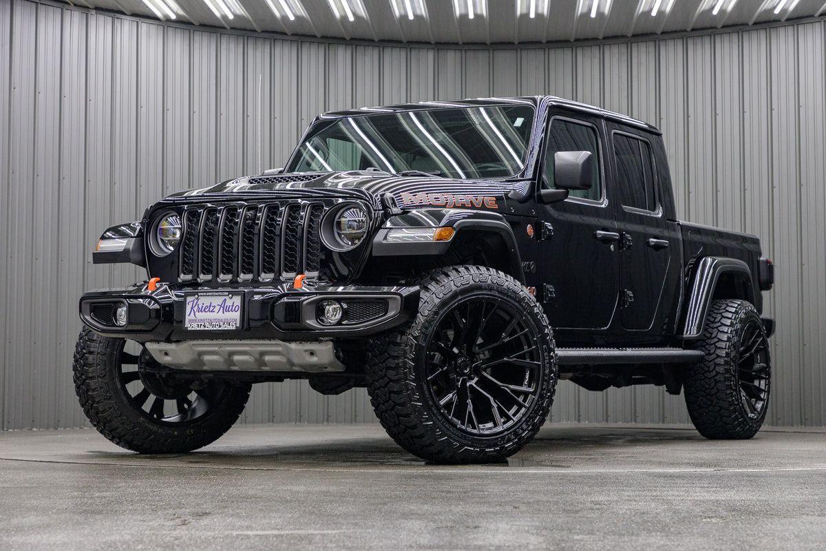 2022 Jeep Gladiator Mojave with Jeep Stock suspension, 22x12 Fuel Rebar wheels, and 35" Fury Country Hunter R/T tires.