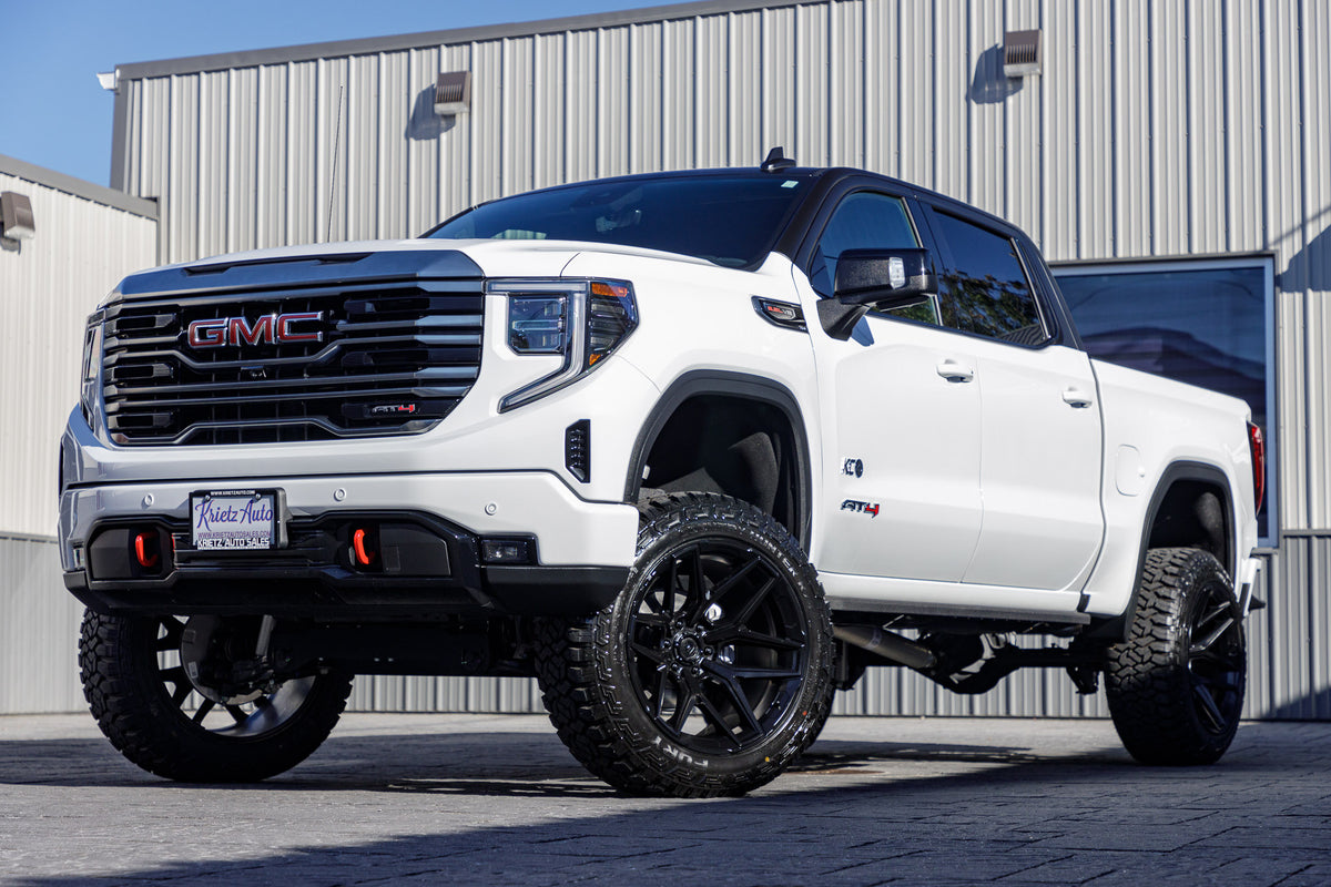 2024 GMC Sierra 1500 AT4 with a 6" Rough Country lift kit, 22x12 Fuel Flux wheels, 35" Fury Country Hunter R/T tires.