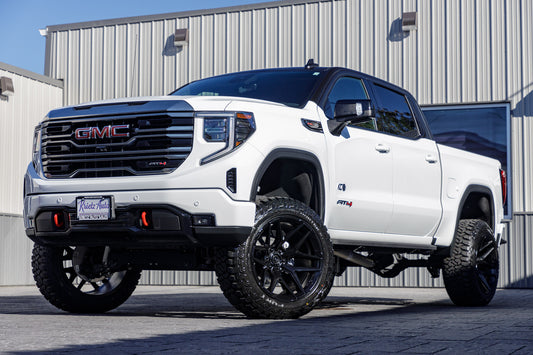 2024 GMC Sierra 1500 AT4 with a 6" Rough Country lift kit, 22x12 Fuel Flux wheels, 35" Fury Country Hunter R/T tires.