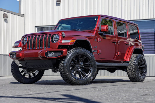 2021 Jeep Wrangler Unlimited Sahara Altitude with a 2.5" Rough Country lift kit, 22x12 Fuel Flame wheels, and 35" Fury Country Hunter R/T tires.