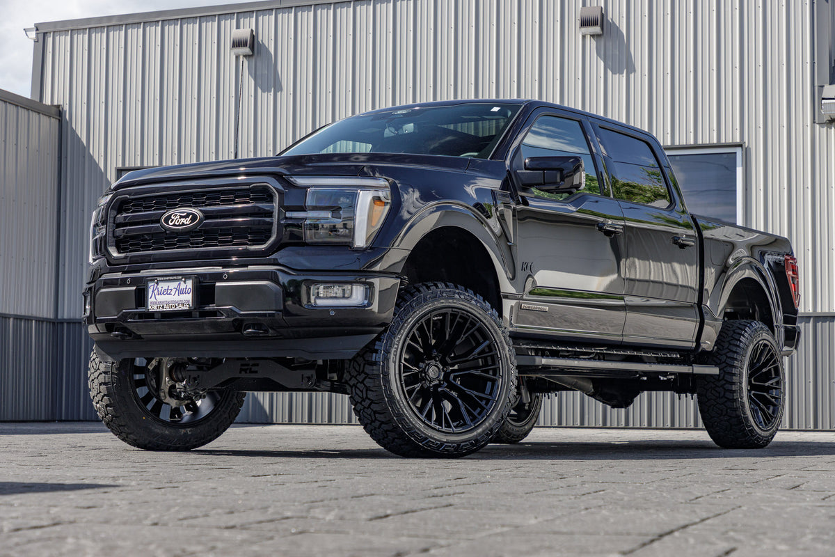 2024 Ford F-150 Lariat with a 6" Rough Country lift kit, 22x12 Fuel Rebar wheels, and 35" Fury Country Hunter R/T tires.