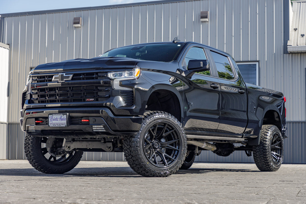 2024 Chevrolet Silverado 1500 LT Trail Boss with a 6" Rough Country lift kit, 22x12 Fuel Catalyst wheels, and 35" Fury Country Hunter R/T tires.