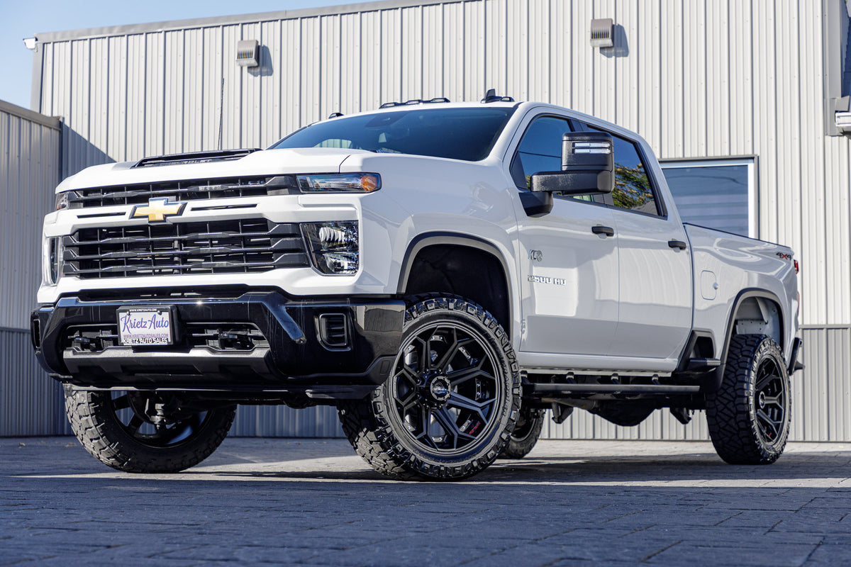 2024 Chevrolet Silverado 2500 Custom with a 3" ReadyLift lift kit, 22x10 4Play 4P80R wheels, and 35" Nitto Ridge Grappler tires.