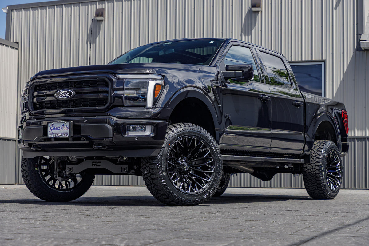 2024 Ford F-150 Lariat with a 6" Rough Country lift kit, 22x12 Fuel Strike wheels, and 35" Fury Country Hunter R/T tires.