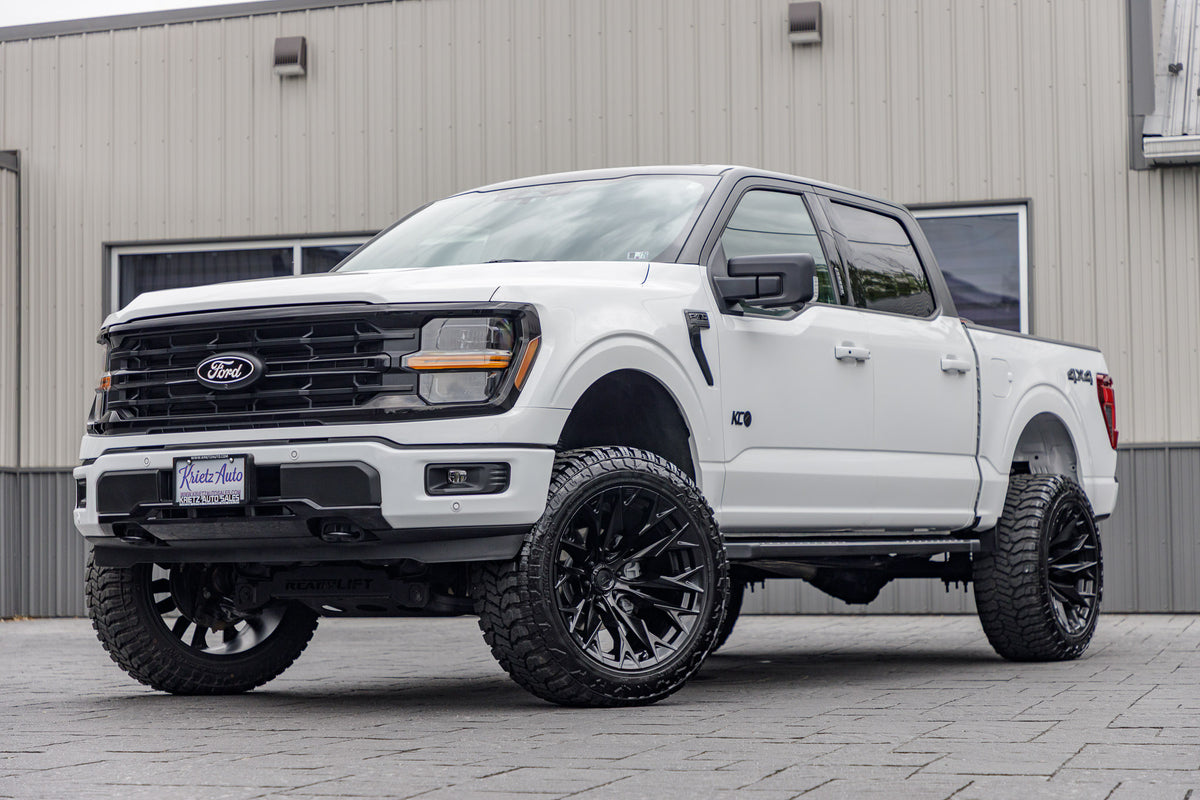 2024 Ford F-150 XLT with a 6" ReadyLift lift kit, 22x12 Fuel Flame wheels, and 35" Avix Trailtek R/T tires.