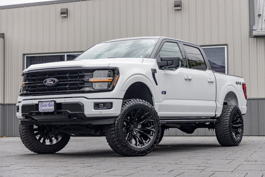 2024 Ford F-150 XLT with a 6" ReadyLift lift kit, 22x12 Fuel Flame wheels, and 35" Avix Trailtek R/T tires.