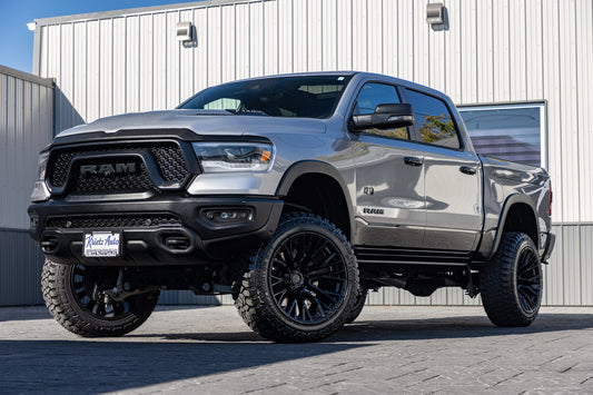2024 Ram 1500 Rebel with a 6" Rough Country lift kit, 22x12 Fuel Rebar wheels, and 35" Fury Country Hunter R/T tires.