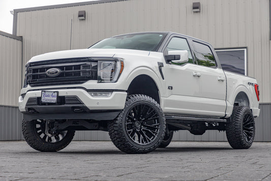 2023 Ford F-150 Lariat with a 6" Rough Country lift kit, 22x12 Fuel Rebar wheels, and 35" Fury Country Hunter R/T tires.