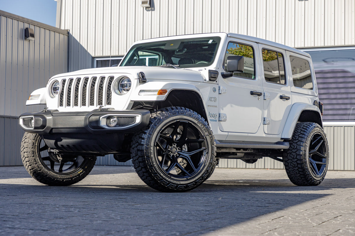 2021 Jeep Wrangler Unlimited Sahara 4XE with a 2.5" Rough Country lift kit, 22x12 Fuel Flux wheels, and 35" Fury Country Hunter R/T tires.