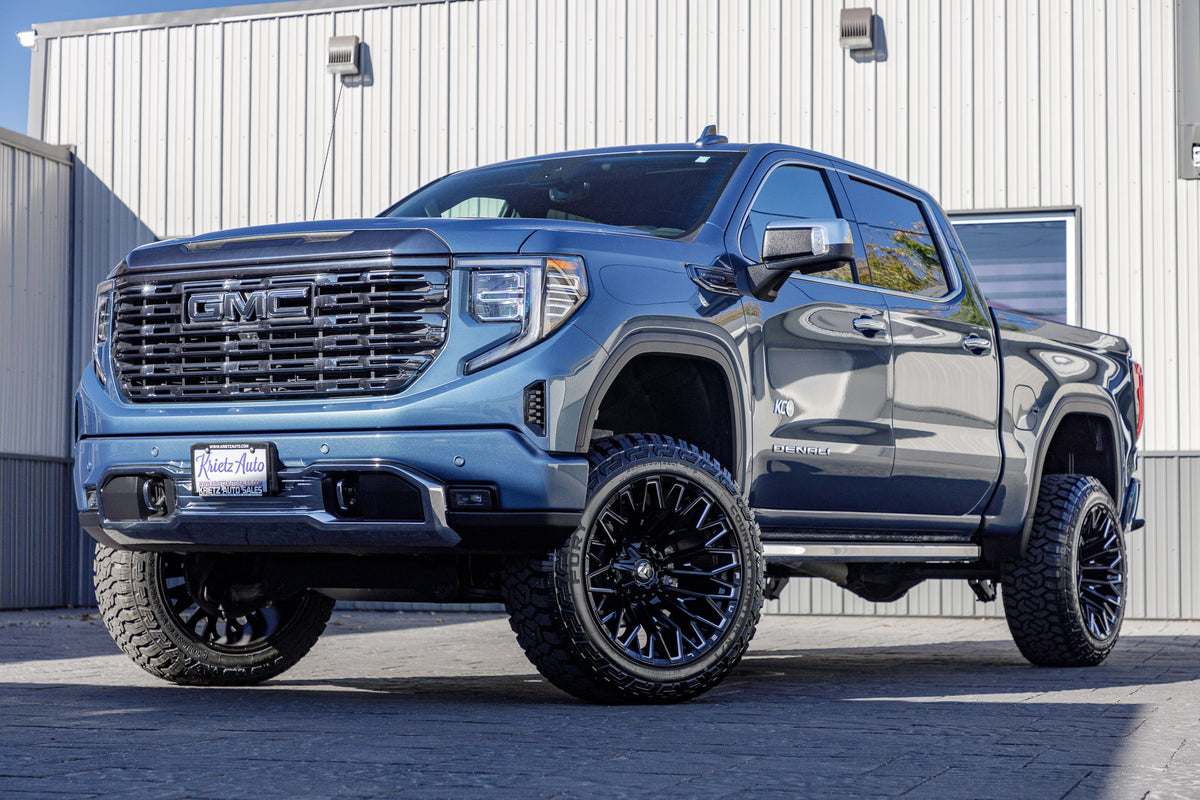 2024 GMC Sierra 1500 Denali Ultimate with a 6" Rough Country suspension kit, 22x12 Fuel Strike wheels, and 35" Fury Country Hunter R/T tires.
