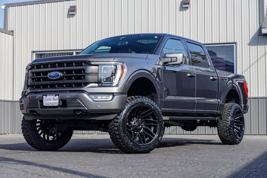 2022 Ford F-150 Lariat with a 6" Rough Country lift kit, 22x12 Fuel Typhoon wheels, and 35" Fury Country Hunter R/T tires.