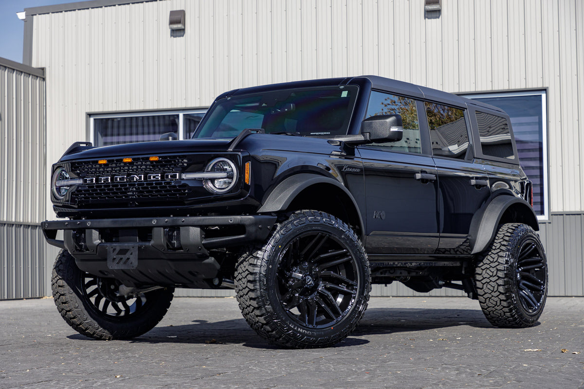 2024 Ford Bronco Wildtrak with a 2.25" Zone lift kit, 22x12 Fuel Typhoon wheels, and 35" Fury Country Hunter R/T tires.