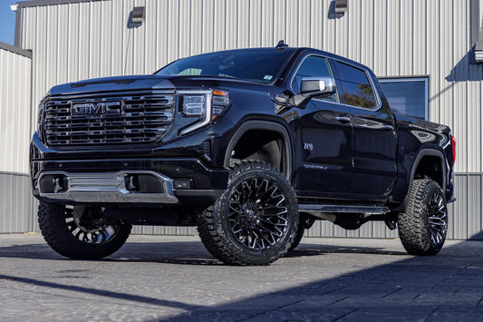 2024 GMC Sierra 1500 Denali Ultimate with a 6" Rough Country suspension kit, 22x12 Fuel Strike wheels, and 35" Fury Country Hunter R/T tires.