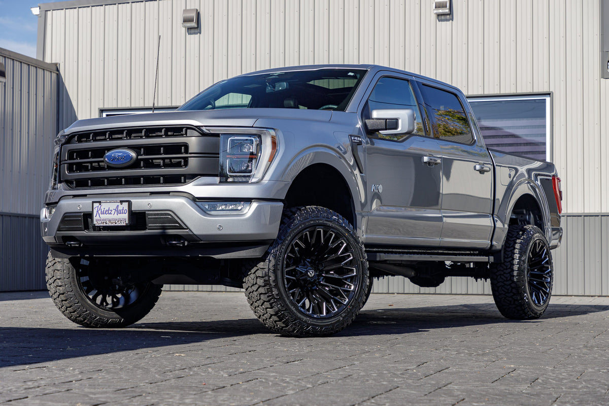 2023 Ford F-150 XLT with a 6" Rough Country lift kit, 22x12 Fuel Strike wheels, and 35" Fury Country Hunter R/T tires.