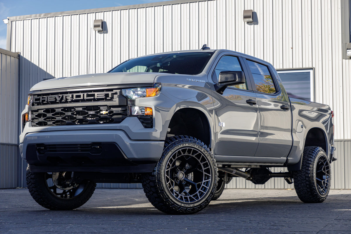 2024 Chevrolet Silverado 1500 Custom with a 6" Rough Country lift kit, 22x12 Fuel Charger wheels, and 35" Fury Country Hunter R/T tires.