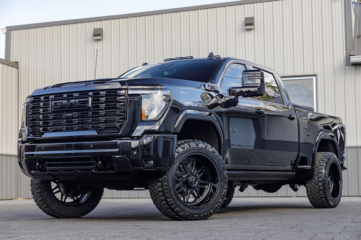2024 GMC Sierra 2500 Denali Ultimate with a 3" Cognito Leveling kit, 22x12 American Force Chief wheels, and 35" Nitto Ridge Grappler tires.
