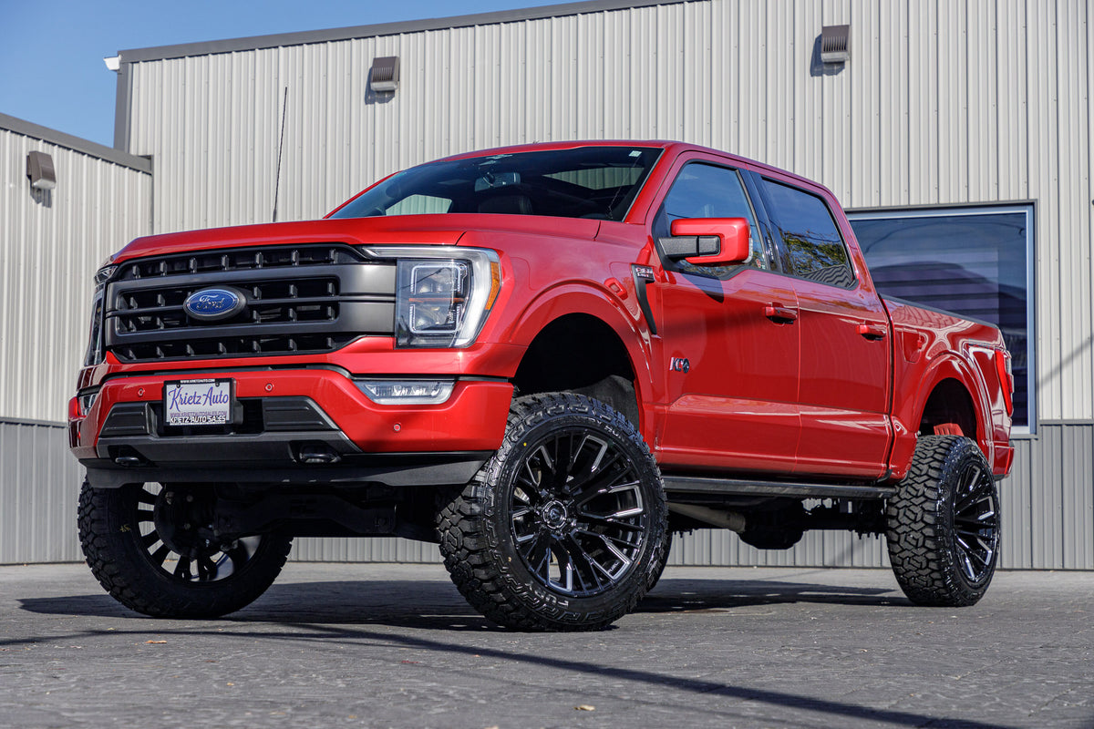 2023 Ford F-150 XLT with a 6" Rough Country lift kit, 22x12 Fuel Rebar wheels, and 35" Fury Country Hunter R/T tires.
