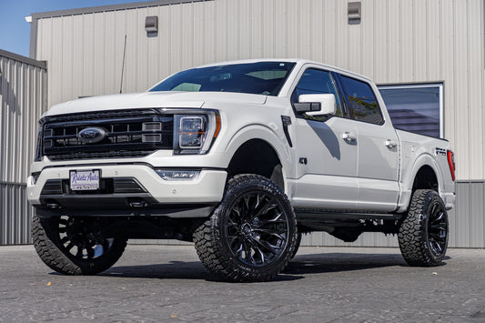 2023 Ford F-150 XLT with a 6" Rough Country lift kit, 22x12 Fuel Flame wheels, and 35" Fury Country Hunter R/T tires.