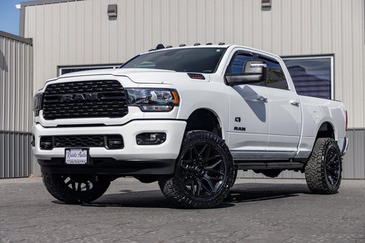 2023 Ram 2500 Big Horn with a 2.5" Rough Country leveling kit, 22x10 Fuel Flux wheels, and 35" Nitto Ridge Grappler tires.