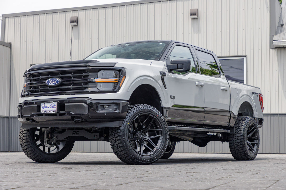 2024 Ford F-150 XLT with a 6" Rough Country lift kit, 22x12 Fuel Flux wheels, and 35" Avix Trailtek R/T tires.