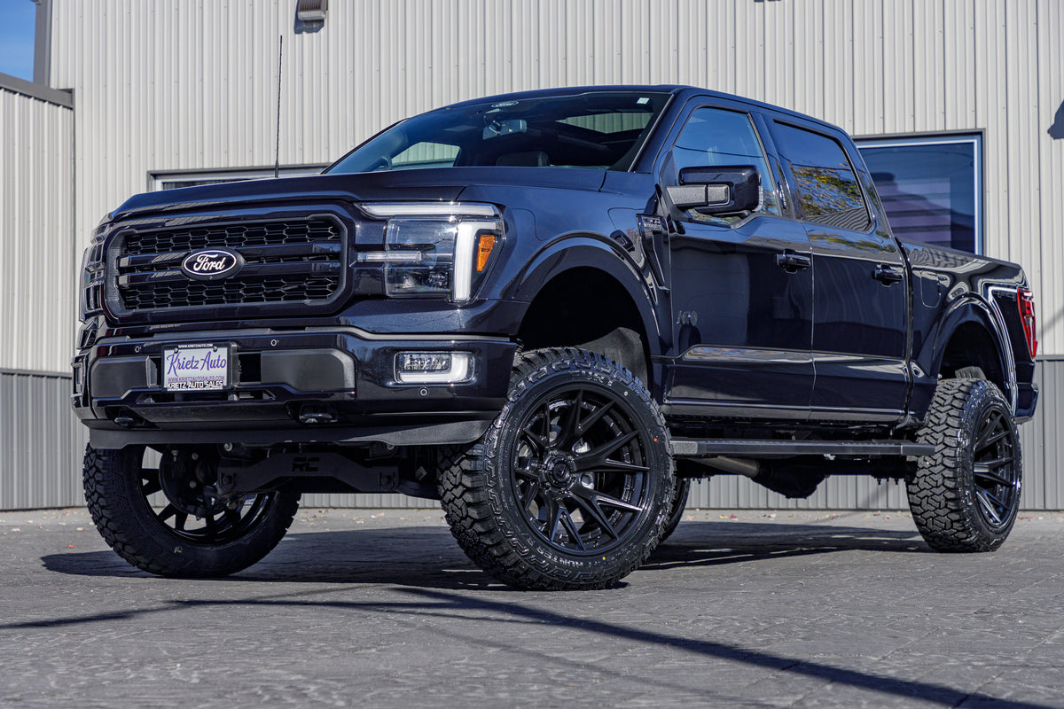 2024 Ford F-150 Lariat with a 6" Rough Country lift kit, 22x12 Fuel Catalyst wheels, and 35" Fury Country Hunter R/T tires.