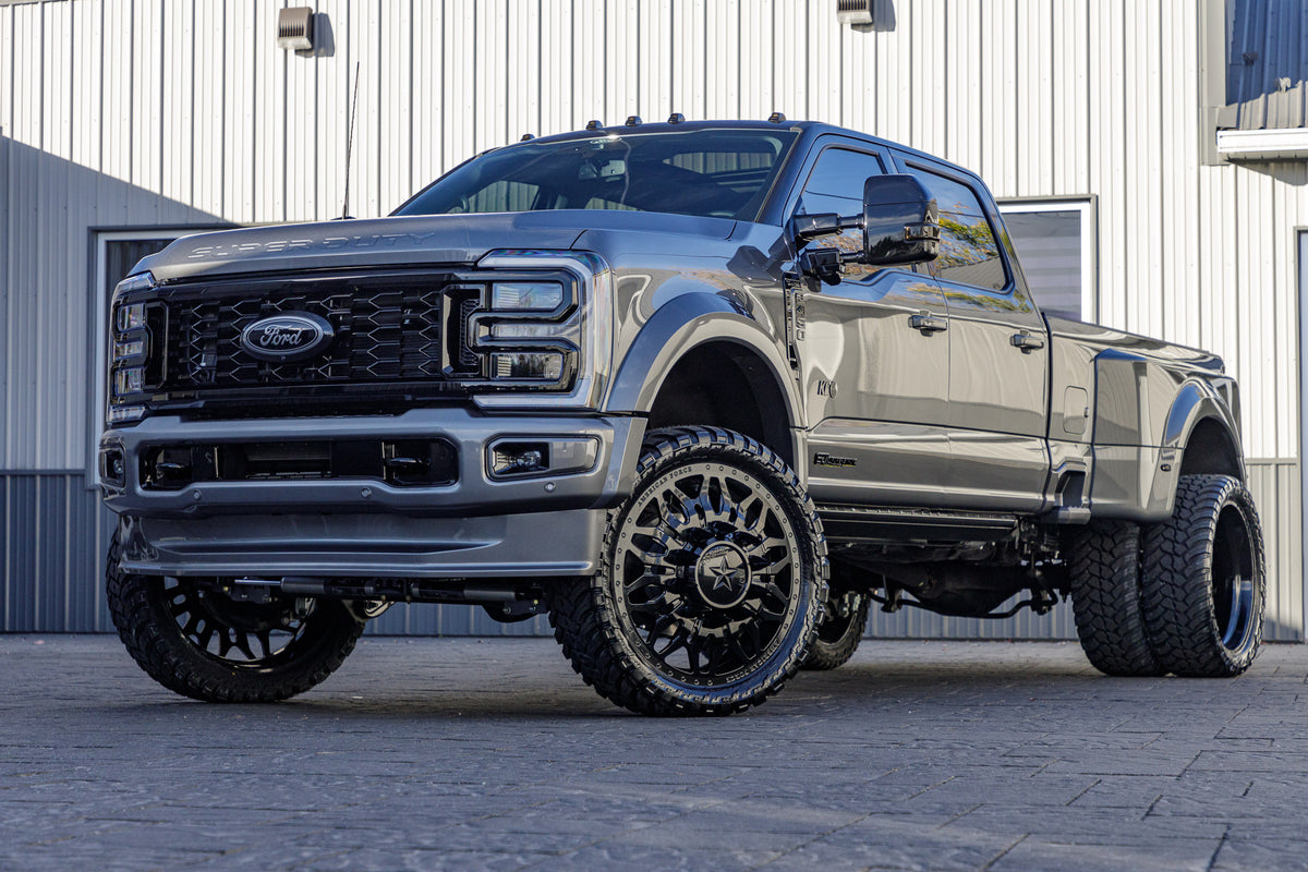 2024 Ford F-450 Super Duty with a 4" Wicked lift kit, 26x8.25 American Force Shrapnel wheels, and 37" AMP Terrain Attack M/T A tires.
