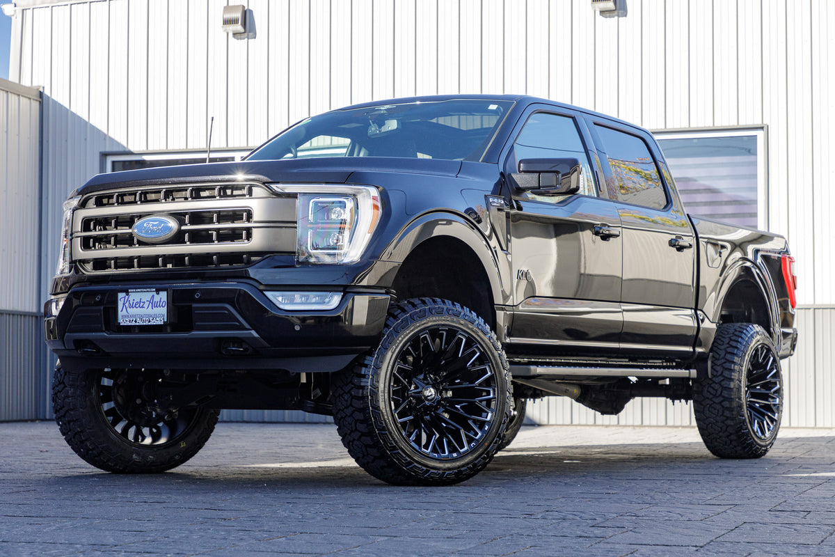 2023 Ford F-150 XLT with a 6" Rough Country lift kit, 22x12 Fuel Strike wheels, and 35" Fury Country Hunter R/T tires.