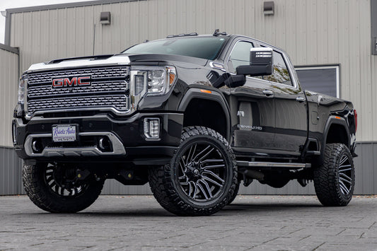 2023 GMC Sierra 2500 Denali with a 5" BDS lift kit, 22x12 Fuel Typhoon wheels, and 37" Nitto Ridge Grappler tires.
