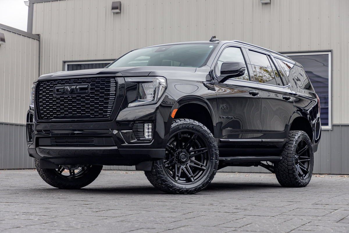 2024 GMC Yukon Denali with a 3" ReadyLift lift kit, 22x10 Fuel Brawl wheels, and 295/50 Toyo Open Country AT3 tires.
