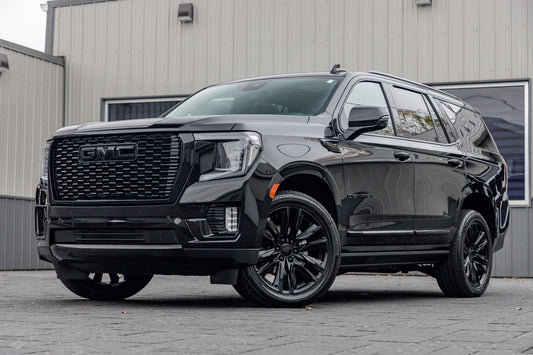 2023 GMC Yukon Denali with GMC Factory suspension, 22x9 GMC Stock wheels, and Bridgestone Alenza tires.