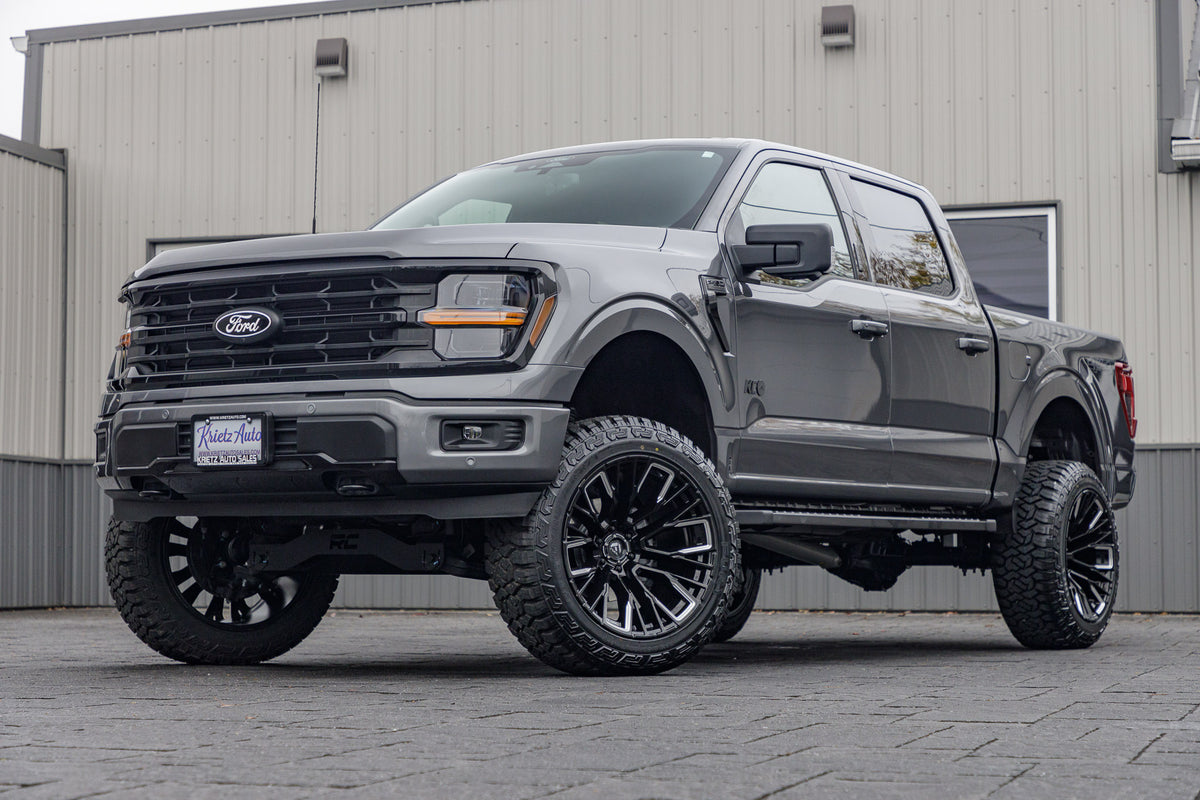 2024 Ford F-150 XLT with a 6" Rough Country lift kit, 22x12 Fuel Rebar wheels, and 35" Fury Country Hunter R/T tires.