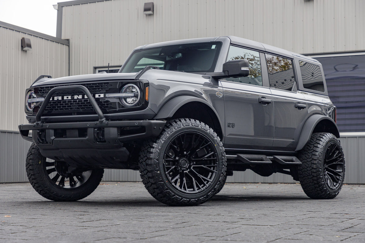 2023 Ford Bronco Wildtrak with a 2.25" Zone lift kit, 22x12 Fuel Rebar wheels, and Fury Country Hunter R/T tires.
