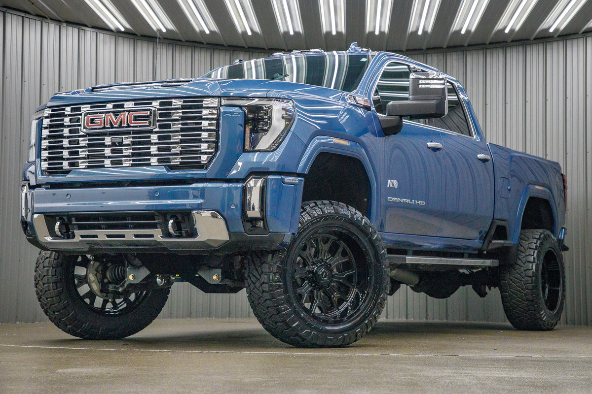 2024 GMC Sierra 3500 Denali with a 5" BDS lift kit, 22x12 TIS 560B wheels, and 37" Nitto Ridge Grappler tires.