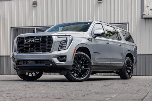 2025 GMC Yukon XL Denali with GMC Factory suspension, 22x9 GMC Stock wheels, and Bridgestone Alenza tires.