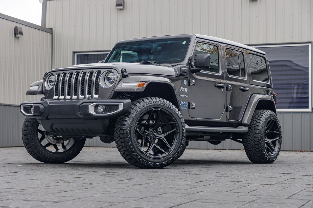 2021 Jeep Wrangler Unlimited Sahara 4XE with a 2.5" Rough Country lift kit, 22x12 Fuel Flux wheels, and 35" Fury Country Hunter R/T tires.