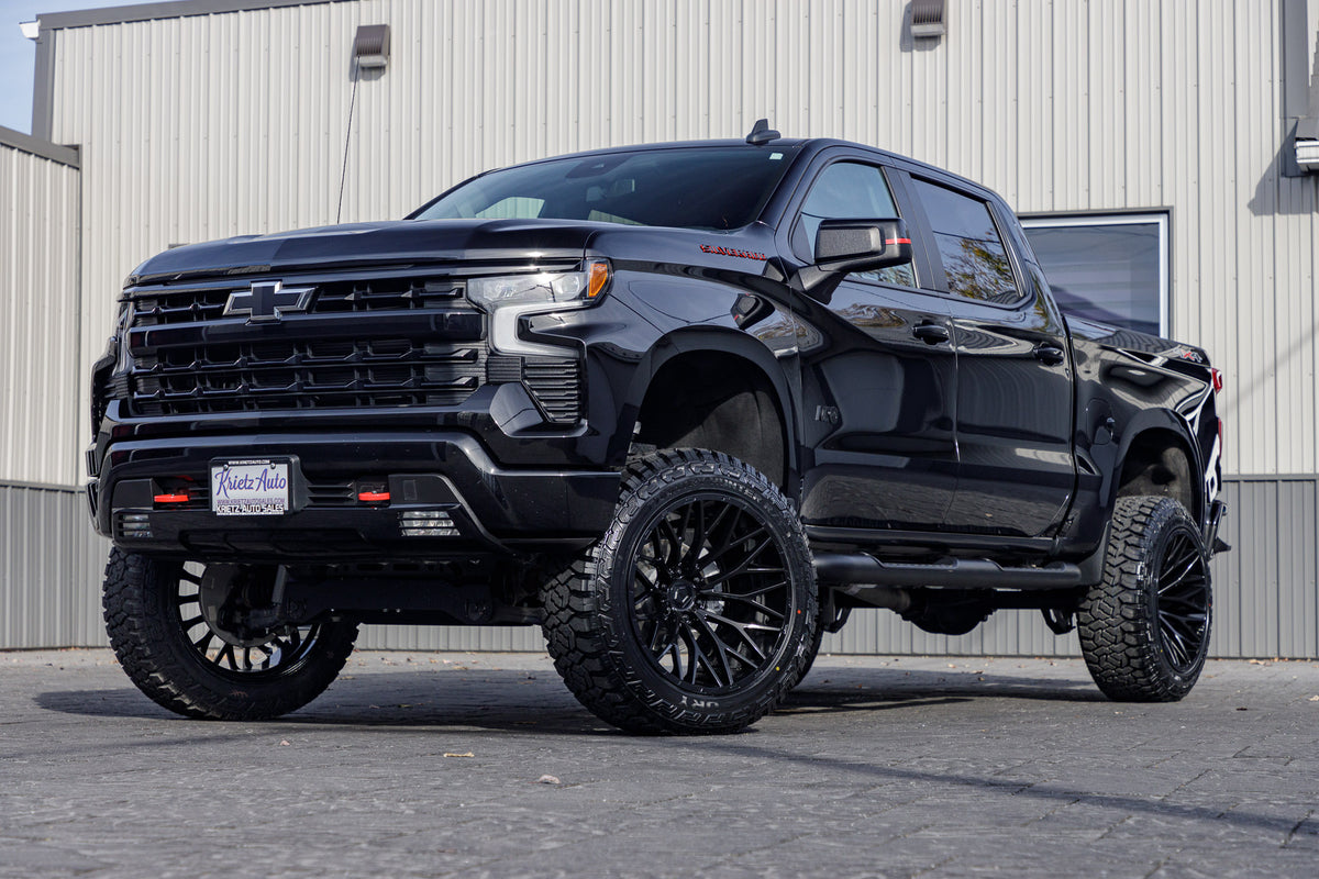 2023 Chevrolet Silverado 1500 RST with a 6" Rough Country lift kit, 22x12 TIS 566B wheels, and 35" Fury Country Hunter R/T tires.