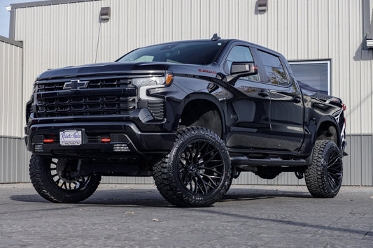 2023 Chevrolet Silverado 1500 RST with a 6" Rough Country lift kit, 22x12 TIS 566B wheels, and 35" Fury Country Hunter R/T tires.