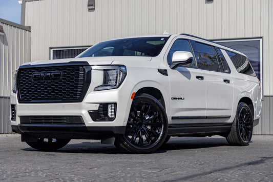 2023 GMC Yukon with GMC Factory suspension, 22x9 GMC Stock wheels, and Bridgestone Alenza tires.